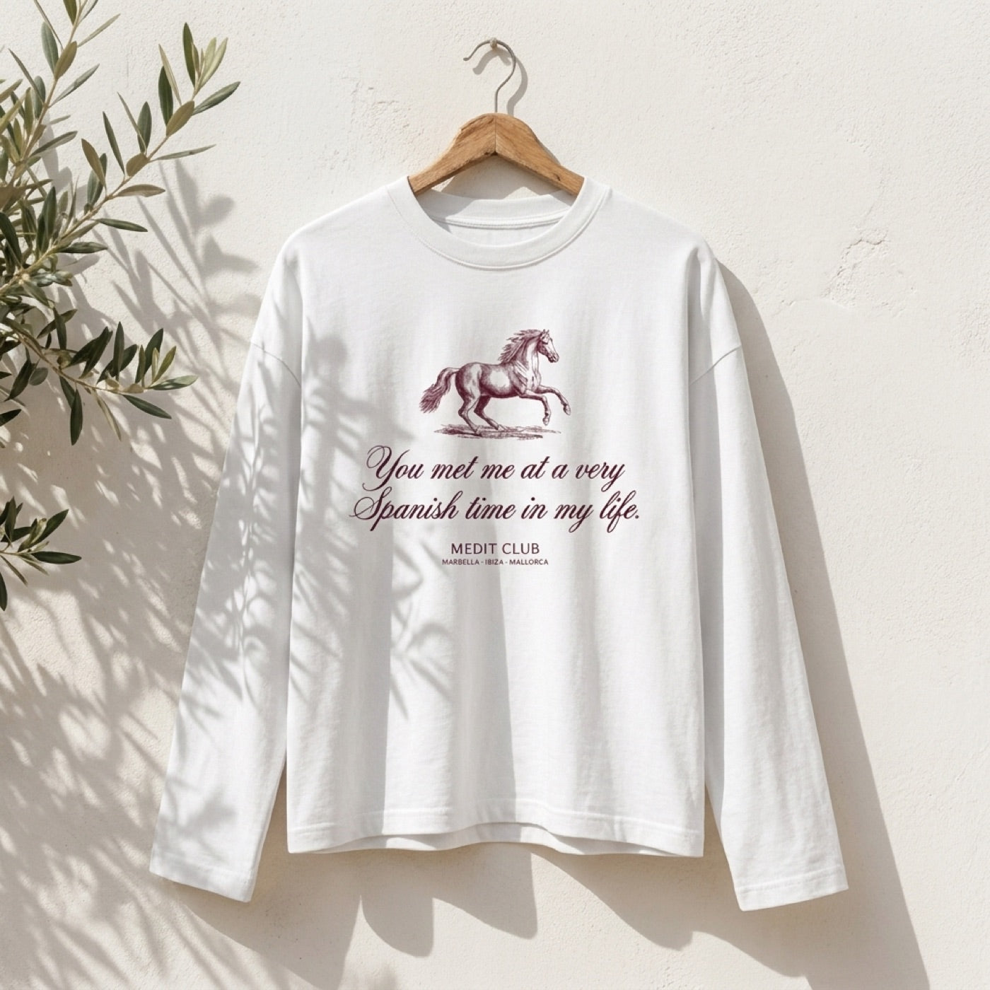 Spanish Time Longsleeve in Ibiza, on a wooden hanger