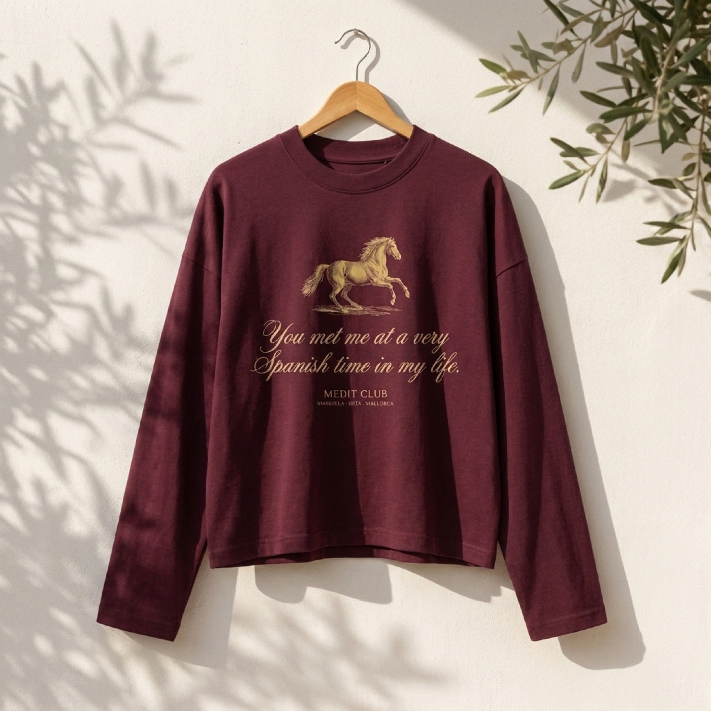 Spanish Time Longsleeve in Marbella, on a wooden hanger